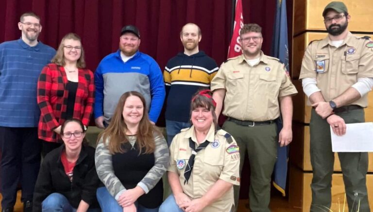 Six new boy and girl cub scouts with bear paws painted on foreheads