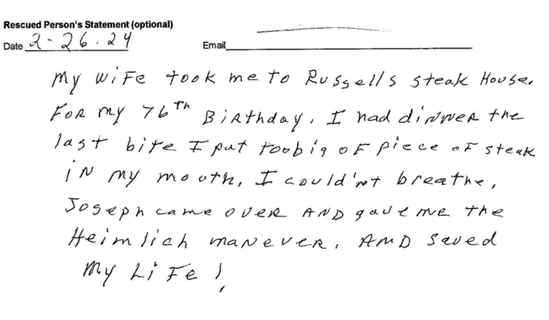 A handwritten note from the rescued person on Feb 26, 2024 that reads, "My wife took me to Russell's Steak House for my 76th birthday. I had dinner the last bit I put too big of piece of steak in my mouth. I couldn't breath. Joseph came over and gave me the Heimlich maneuver and saved my life!